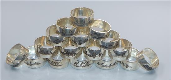 A matched set of seventeen white metal and niello serviette rings, gross 340 grams.